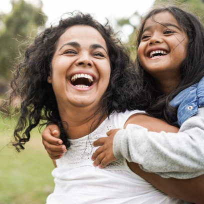 happy indian mother having fun with her daughter outdoors ist1325578537