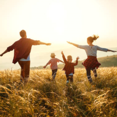 Happy family: mother, father, children son and daughter on nature on sunset